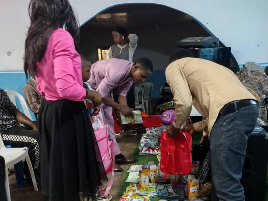 COHEC volunteers preparing backpacks for distribution