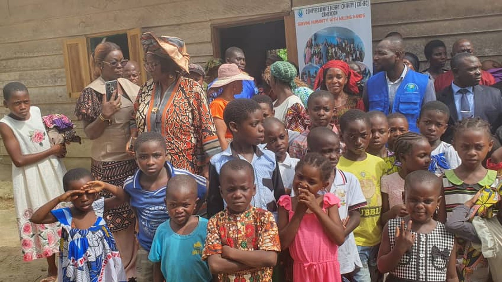 COHEC leaders and volunteers with a large group of children